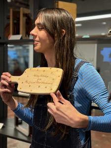 Lucy shows holiday gift cutting board laser engraved